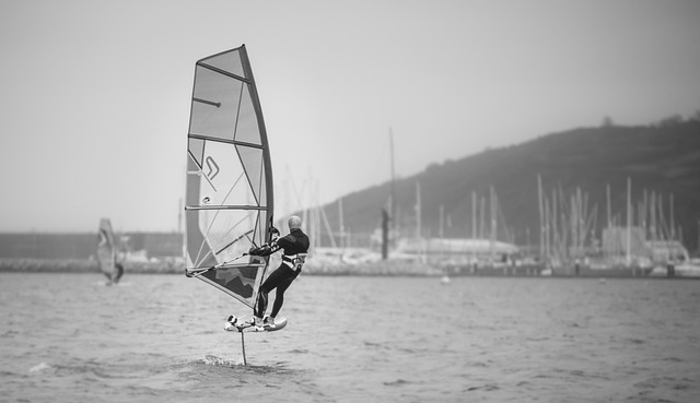 Windsurfer foiling above the water on a hydrofoil, illustrating the hydrofoil optimization case study