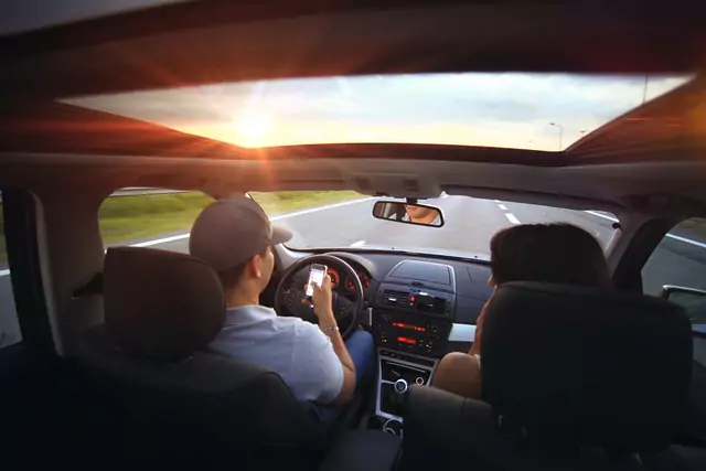 Car interior with sunlight streaming through a transparent sunroof, a source of solar heat gain for cabin HVAC design