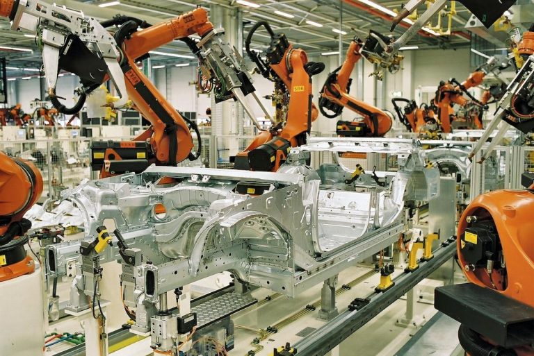 KUKA industrial robots spot-welding BMW 3 Series car bodies at the Leipzig plant