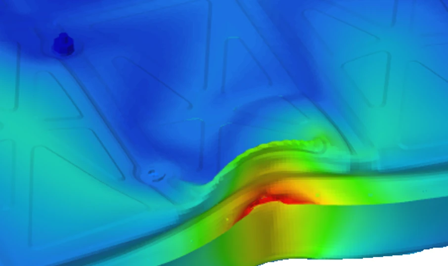 Crash simulation contour of an EV battery encasing under lateral pole impact, red hotspot marking potential damage