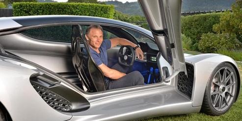 Kevin Czinger seated in the generatively designed, additively manufactured Czinger supercar with its door raised