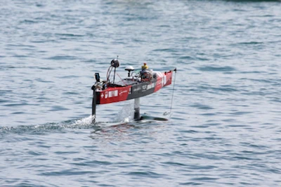 HydroContest EPFL light boat foiling during the 2016 race, hull lifted above the water on its hydrofoils