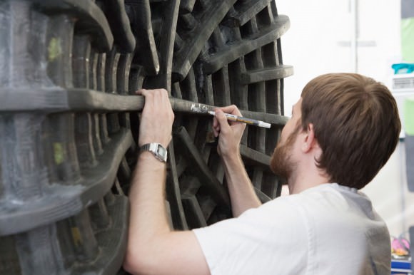 Engineer signing off on an aircraft cockpit structure before it is mated with the fuselage