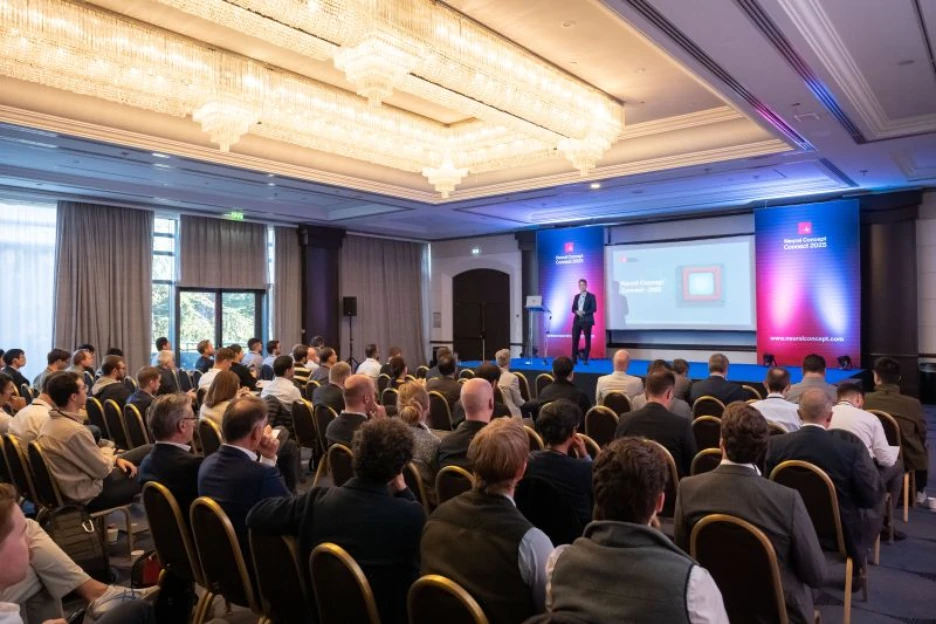 Audience in a hotel ballroom watching a speaker on stage at Neural Concept Connect 2025