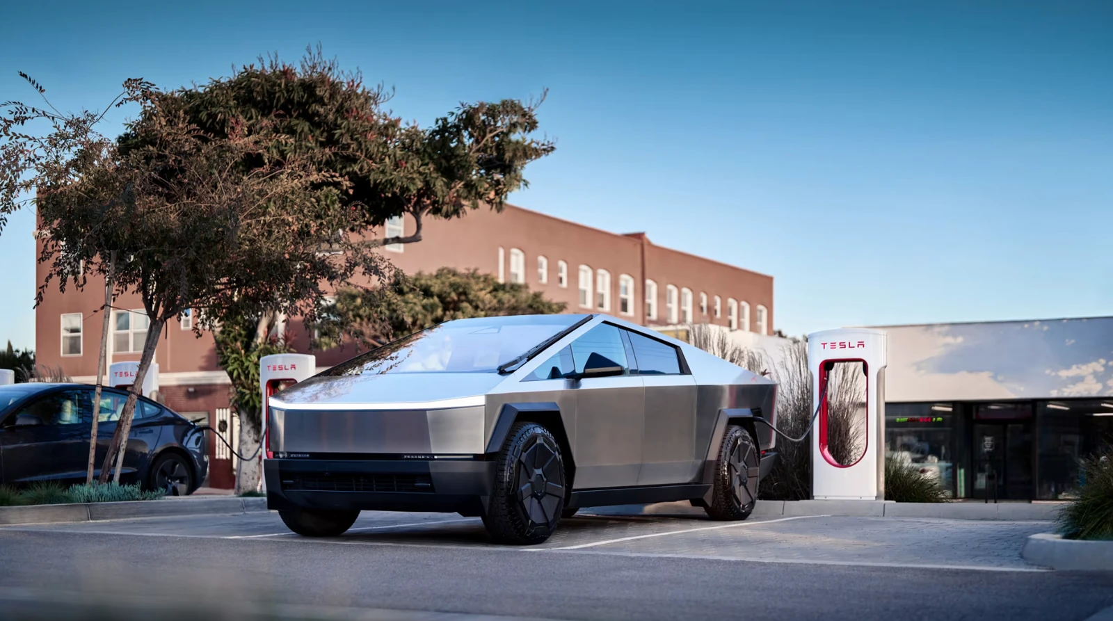 Tesla Cybertruck charging at a Tesla Supercharger, illustrating the thermal management demands of fast-charging EV batteries